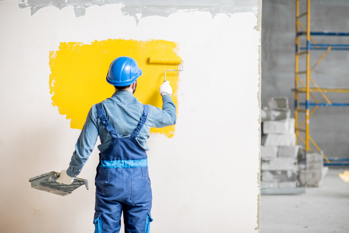 Workamn Painting Wall Indoors